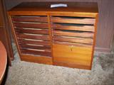 silverware storage with felt lined drawers and rollup front panel