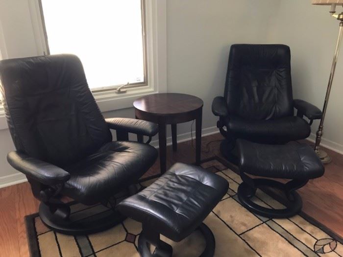 Two Ekorns Stressless Leather chairs and ottomans
