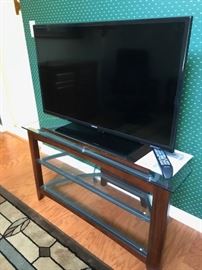 One of two TVs and stands.  This is a Samsung TV
