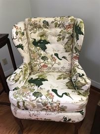 One of two wing back chairs  has a matching sofa