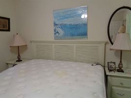 king bed w/wooden white headboard, great mattress on this bed