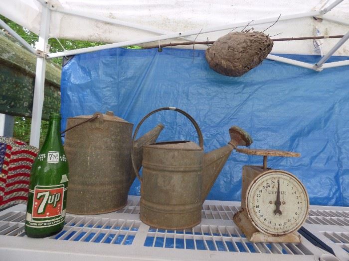 Vintage galvanized watering cans, scale, 7UP bottle, hornet's nest