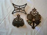 Two wrought iron matches containers and trivet from the late 1800's