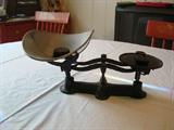 Wrought iron balance scale with removable metal weighing tray and four counterweights: 1/2oz, 1oz, 2oz & 4oz circa late 1800's - early 1900's