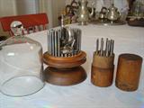 These are old watchmaker tools sets that we found in the basement. The glass bell is designed to cover the set on the circular base. The other cylinder set closes with the top shown at the far right. Pretty cool, huh?
