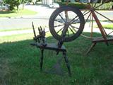 Small authentic (NOT REPRODUCTION) solid wood spinning wheel, features all the necessary spools to turn raw sheared wool into thread. Buy both spinning wheels to create an eye-catching display in any room.