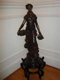 This original brass sculpture sits approximately 36" from base to top and is simply exquisite and would brighten any corner in your home.