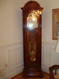 A classic Grandfather clock manufactured by Sligh, makers of outstanding timepieces that are the centerpiece of fine homes around the world. This one is beautifully crafted of fine stained hardwoods and precious metals.