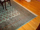 Detail of this original Persian rug that currently sits in the dining room. NOTE: THE DINING ROOM SET IS NOT FOR SALE! This outstanding rug that looks ever better in person, measures approximately 10' x 16'.