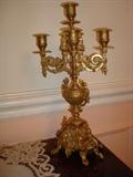 Perfectly ornate in the Rococo style, this matching pair of candelabras will send the same message in your home as they do in this one. That message is one of style, taste and substance.