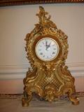 This exquisite "Rococo" styled mantel timepiece is even more lovely up close and personal. Made in Germany this is a unique piece that will enliven any mantel it adorns.