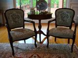 Two lavishly upholstered and embroidered parlor chairs made of the finest hardwoods by some of the finest furniture craftsmen in the world. So pretty you just want to look at them instead of sitting on them and as you can tell these have not been sat on much at all. The table and accessories are also for sale. We have a better shot of the table coming up. To see the chairs you really need to be here the days of the sale. Although, I don't think these will make it to Sunday.