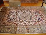Perhaps the finest of all the Persian rugs offered for sale in this home, this rug which measures approximately 6.5' x 10' is made of silk. You can only imagine how soft and lush this original Persian rug feels until you come here and sweep you hand over it.