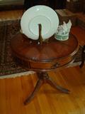 For those of you who may be in the market for a lovely, but inexpensive end table for your living or family room, unfortunately . . . this is not it.
This table which if you look at the top carefully, has veneer inlays running around the circumference of this circular table. Then additional veneers are positioned aiming into a center of the table, then cut out inside those pieces are veneers sectioned to create a star in the center of the table. And that's just the top. This table was built by true furniture and cabinet craftsmen and women.
This table is for the furniture connoisseur who is more interested in owning and enjoying a table of this fine caliber and craftsmanship than simply buying an end table for the living room.