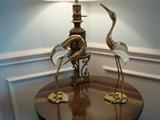 You're not going to find a similar pair of delicate, elegant, polished brass and hand-blown glass lamps in Home Depot or Home Decor or any bargain furniture store.
That's because the exceptionally graceful lines created by this pair - just one example of why these are two very special birds - were created by an artist represented in a gallery. These two pieces of fine art are looking to display their beauty in a very special home. Perhaps yours.