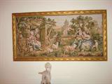 Another finely executed tapestry wrapped beautifully in a gold leaf around wood frame.