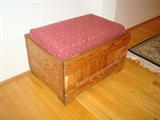This End Up styled bench/ottoman that includes storage space underneath.