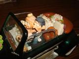 Detail of the honeymooners and their luggage in this excellent hand-crafted sculpture.