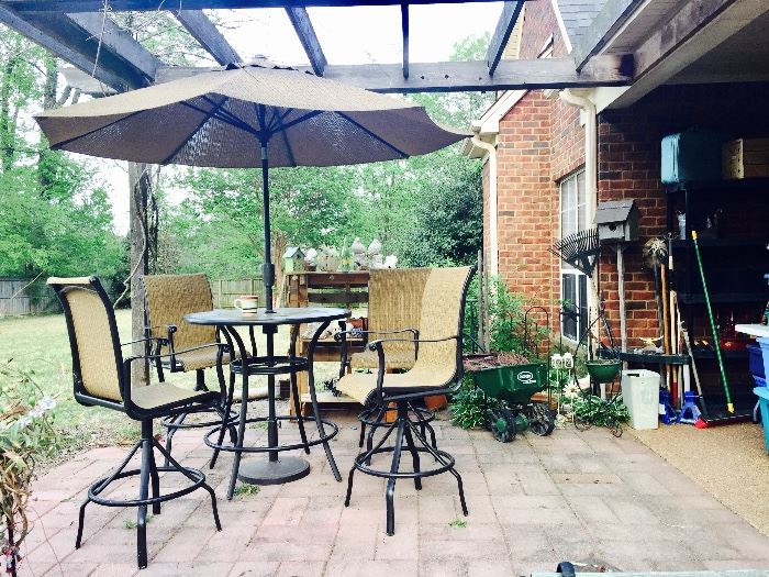 Patio set includes table, umbrella & 4 chairs. 