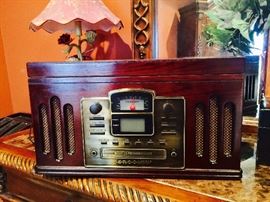 Crosley vintage style system, record player & cassette deck on the side.