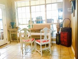 Small glass table. Can also be used as a sofa table. Set of 2 chairs have been recently redone. Table & small chest on each of the 2 corners are both vintage.