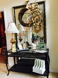 Sofa table has a matching end table. Glass top with rock finish 2nd shelf. Metal. Large oversized mirror measures approx.  3.5 x 6.5