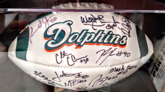 Miami Dolphins signatures: Ryan Baker, Jimmy Wilson, Reshad Jones H2O, Marcus Brown, Richie Incognito, Chris Clemson, Nat Moore, Mack Moore, Charles Bennett, Don McNeal, Will Yeatman, Jason Trusnik, Charles Clay & Daniel Thomas in display case.
