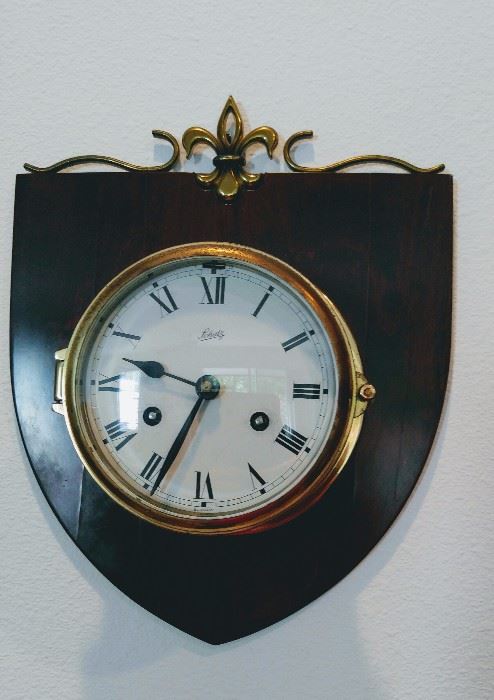 Nautical clock with key.  If you purchase, the family stated only 3 turns of the dial will wind the clock.