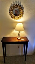 Beautiful entry table, mirror and lamp will welcome your guest.