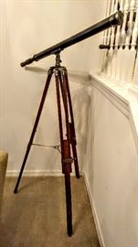 Telescope with nickle finish and double wooden legs with chain holding them together