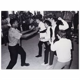 Photograph of Muhammad Ali and The Beatles: A black and white photograph on Kodak Professional Endura paper depicting boxer Muhammed Ali and the Beatles. This photograph presents unframed.