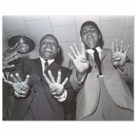 Muhammad Ali Licensed Photograph: A licensed photograph depicting boxer Muhammed Ali. This photograph is printed on Kodak photo paper. Presents unframed.