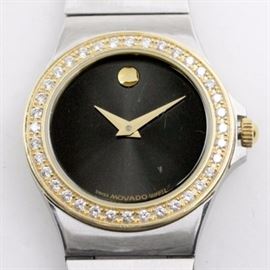 Movado 18K Yellow Gold, Stainless Steel, and Diamond Women's Wristwatch: A stainless steel and 18K yellow gold Movado women’s wristwatch featuring a diamond bezel and stainless steel bracelet with a hidden clasp.