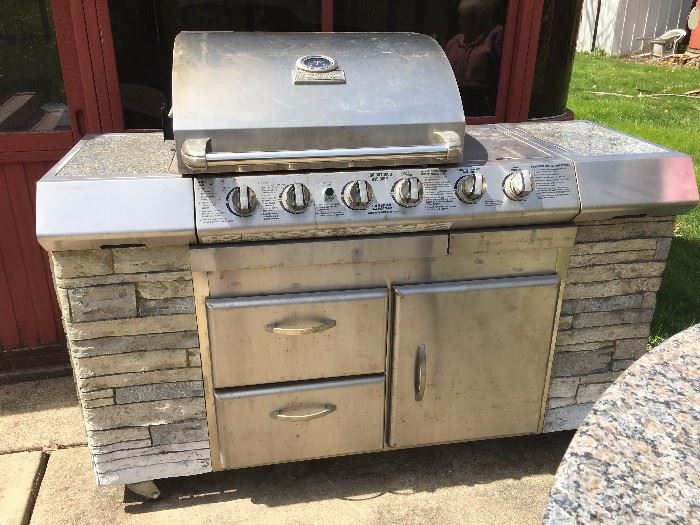 Charmglow gas grill with brick front and storage