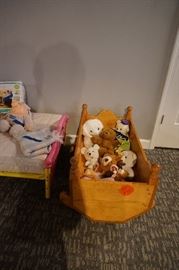 stuffed animals and doll cradle 