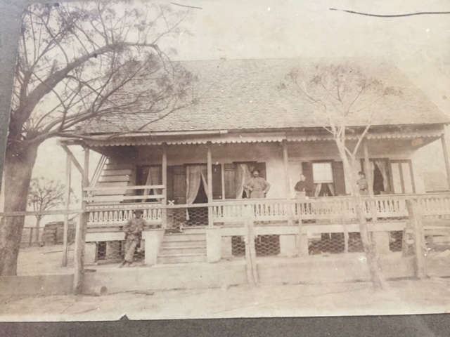 Original front view of the house with the Bertrand family