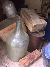 many wooden crates and wine jugs original to house