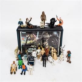 Vintage Star Wars Action Figures With Case: A set of vintage Star Wars action figures in a case by Kenner. Twenty-six original characters from the original Star Wars are found in this vintage vinyl case. Each piece is stamped to the reverse with the date and the maker’s mark.
