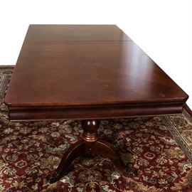 Broyhill "Mason Lenoir" Dining Table: A Broyhill Maison Lenior dining table. This large dining table features clean lines and a dark finish with a slightly curved apron, and includes two 18.00" leaves. The table sits upon double pedestal supports and ends in saber feet. This piece matches items 17COL054-004, 17COL054-005, 17COL054-006 in this sale.