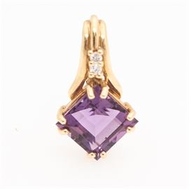 14K Yellow Gold, Diamond and Amethyst Pendant: A 14K yellow gold, diamond and amethyst pendant. This bright 14K yellow gold slide pendant features a square step cut amethyst with two diamonds above.