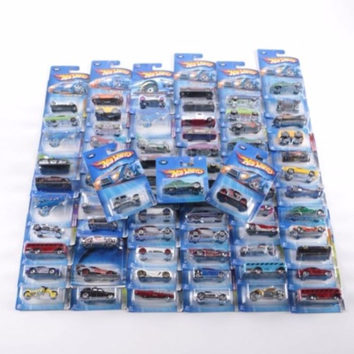 Hot Wheels Die-Cast Car Collection: A Hot Wheels die cast car collection. The collection include seventy two cars from the late 20th and early 21st century. All the cars are in unopened original boxes and some are firtst editions. The collection includes White Heat , Blings , Final Run , Dodge Magnum and more.
