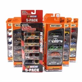 Matchbox Car Gift Sets: An assortment of Matchbox car gift sets. Featuring forty five cars total, and nine gift packs, this selection includes a “Racing Champions” NASCAR 5-pack, “Storm Trackers,” “Camp Jeep,” “Car Wash,” “Mount Discovery,” “Airways,” “Scrapyard,” “World Cup Soccer,” and more. This assortment was produced in the late 1990s/early 2000s.
