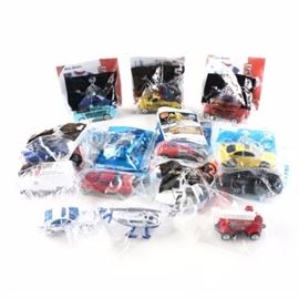 Happy Meal Toy Cars Collection: A Happy Meal toy cars collection. The fifteen bags in this lot include a Power Rangers Power Coin Pack. Items in this assortment include a police car, a helicopter, a vintage racing car, and various sports cars.