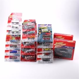 Collection of Johnny Lightning Die-Cast Cars: A collection of Johnny Lightning die-cast cars. This collection consists of twenty nine cars in the original packaging. There are nineteen single packs and two packs of five. Included are woodys and panels, an Austin Powers “Shaguar”, a 1957 Chevy Bel Air, cars featured in Car Craft Magazine, a 1971 Plymouth Duster 340, and more.