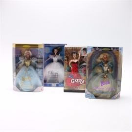 Special Edition Barbie Dolls: A collection of special edition Barbie dolls. Included are Barbie as Sleeping Beauty originally released in 1997, Collector Edition Barbie as Cinderella originally released in 1996, Grease 30th Anniversary Barbie as Dance Off Rizzo originally released in 2008, and Swan Ballerina from Swan Lake originally released in 2001. Each doll is presented in original box packaging.