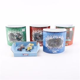 Collection of Holiday Hot Wheel Sets: A collection of holiday Hot Wheel sets. This collection consists of five sets, with four in the complete original packaging. Included are four Christmas themed sets featuring Santa and his elves, and one set of race cars.