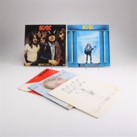 AC/DC and Van Halen Albums: A group of AC/DC and Van Halen albums. This collection features AC/DC albums such as Highway to Hell, Who Made Who, and Flick of the Switch. Also includes Diver Down and 1984 by Van Halen.