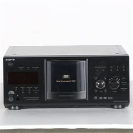 Sony "Disc Explorer 400" Media Player: A Sony Disc Explorer 400 progressive-scan DVD and SACD player. This media player from Sony features the ability to play multiple formats of DVDs, SACDs, and CDs. Includes built-in control functions to front of chassis that allow for disc menu navigation. Item is prominently marked “Sony” to upper left corner of the item’s front.