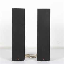 Klipsch "SF-1" Floor-Standing Speakers: A pair of Klipsch SF-1 floor-standing speakers. These matte black wooden, floor-standing speakers feature a maximum input power of 100 Watts and a speaker impedance rating of 8-ohms. Speakers feature inputs for traditional speaker wire. Pieces are marked by manufacturer to front and are labeled to reverse.