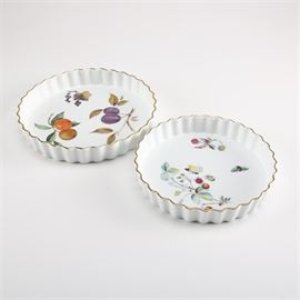 Royal Worcester Quiche Dishes: A selection of Royal Worcester quiche dishes. This selection features a Evesham dish featuring a fruit design and gold-tone trim and a Strawberry Fair dish featuring a strawberry plant, butterfly, bee design with gold trim. Each piece is marked “Royal Worcester Flameproof Porcelain England” on the base.